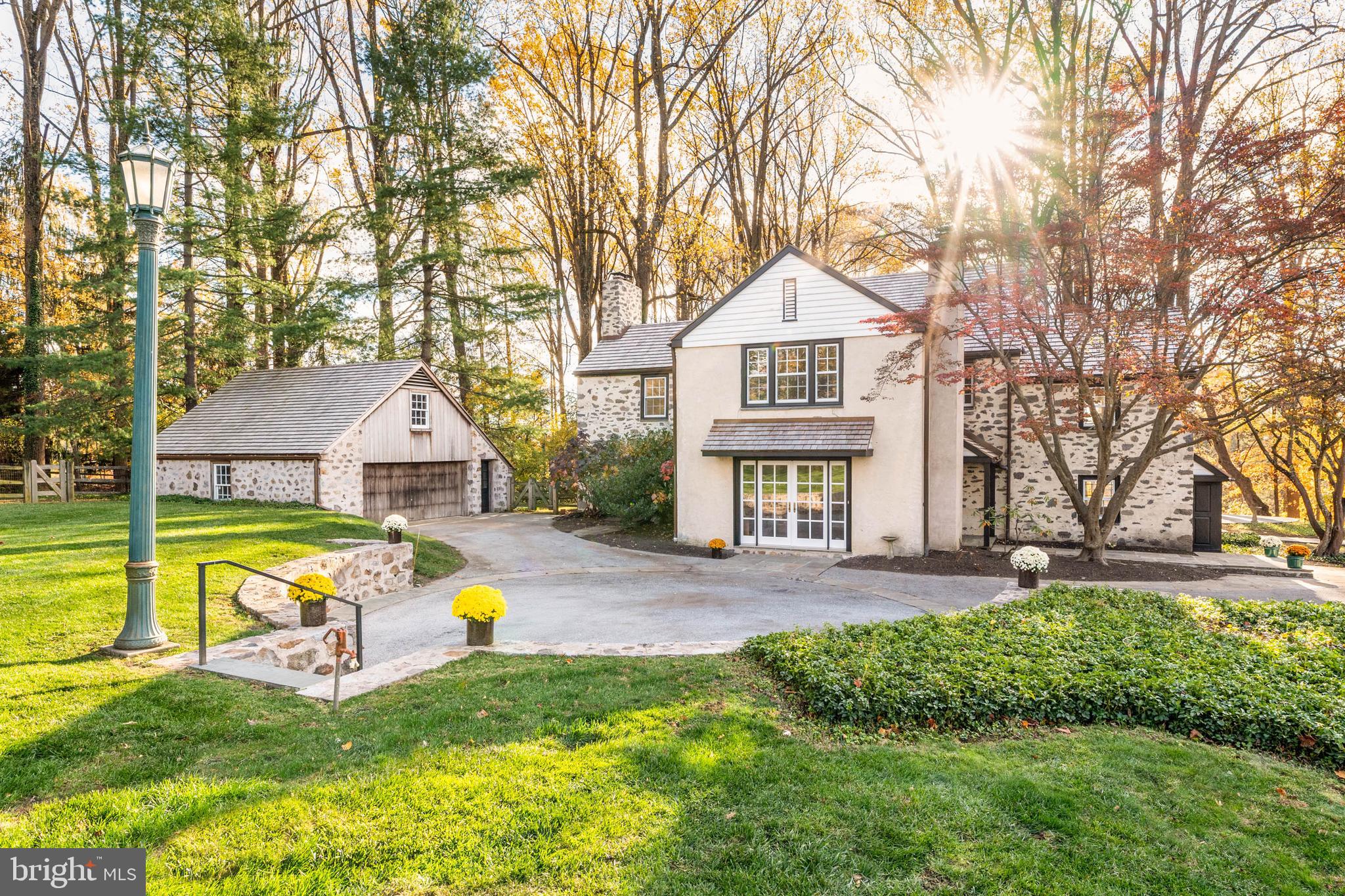 188 Abrahams Lane Villanova, PA 19085 - Photo 7 of 49 a front view of a house with a big yard and large tree