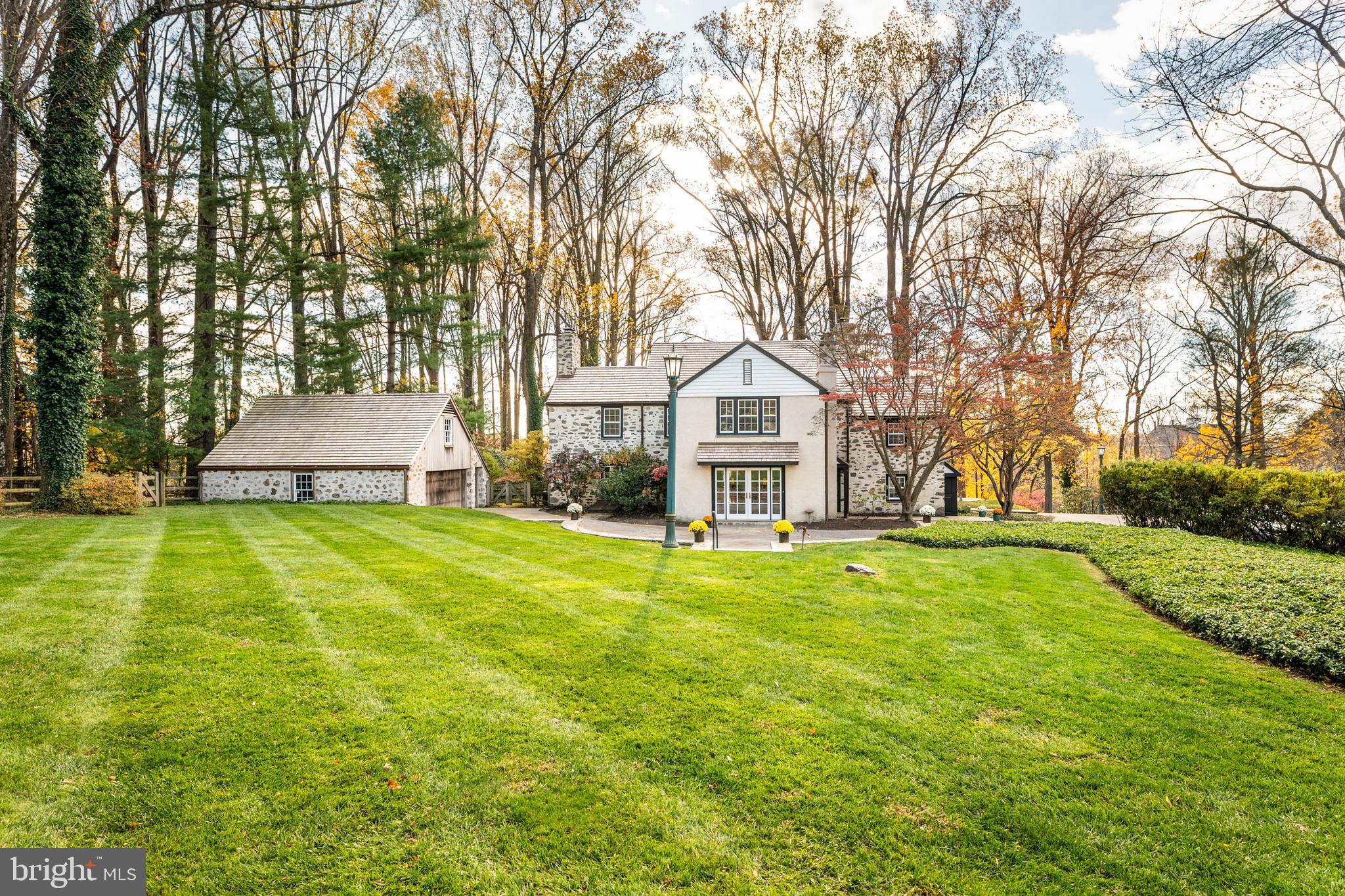 188 Abrahams Lane Villanova, PA 19085 - Photo 8 of 49 a front view of a house with a yard and trees