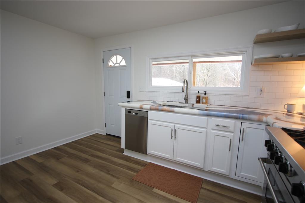 1930 State Rte 2023 Monongahela, PA 15063 - Photo 6 of 41 a kitchen with granite countertop white cabinets and white appliances