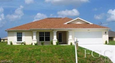 2306 Nelson Road North Cape Coral, FL 33993 - Photo 1 of 1 a front view of a house with a yard