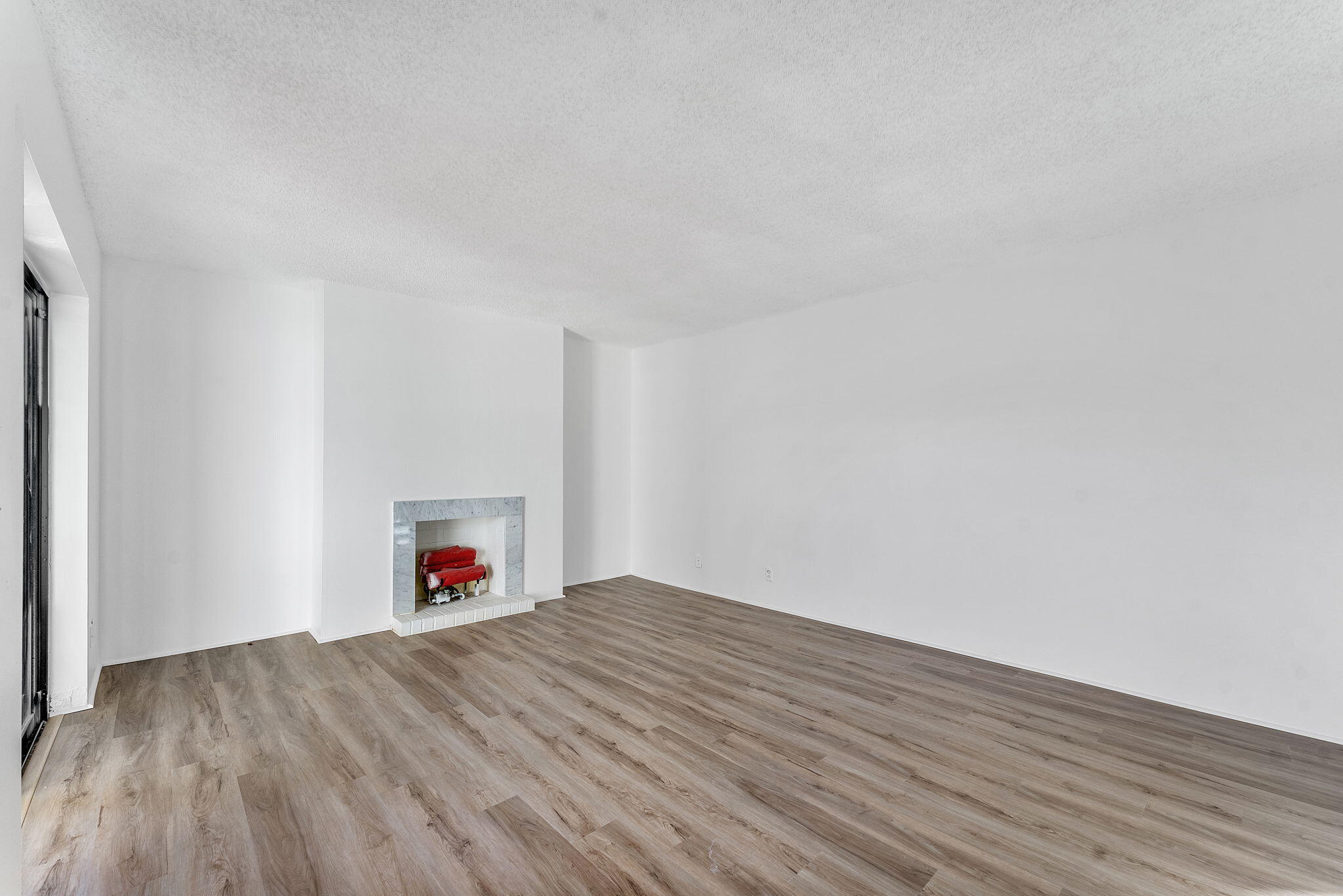 291 Woodland Road Palm Springs, FL 33461 - Photo 11 of 32 a view of a livingroom with wooden floor