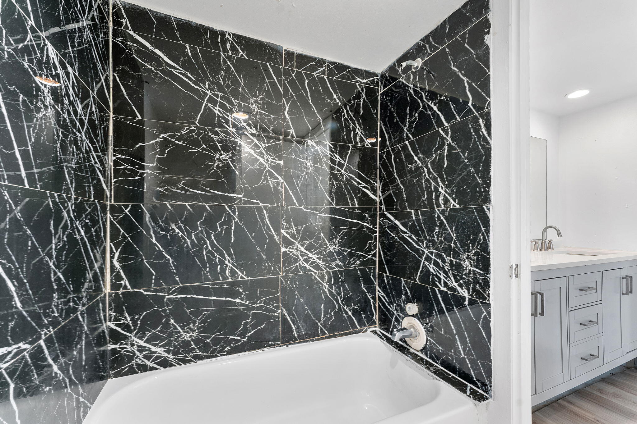 291 Woodland Road Palm Springs, FL 33461 - Photo 18 of 32 a bathroom with a shower and a sink