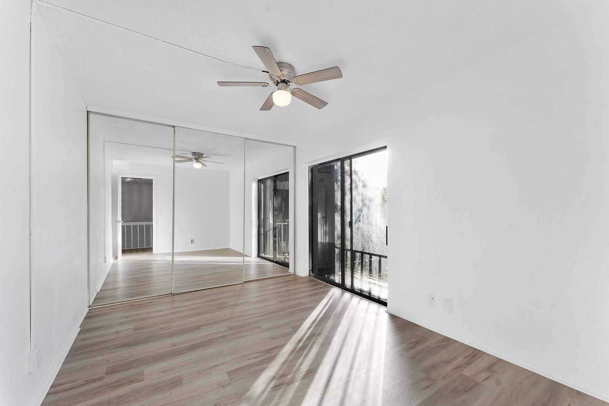 291 Woodland Road Palm Springs, FL 33461 - Photo 23 of 32 a view of a hallway with wooden floor