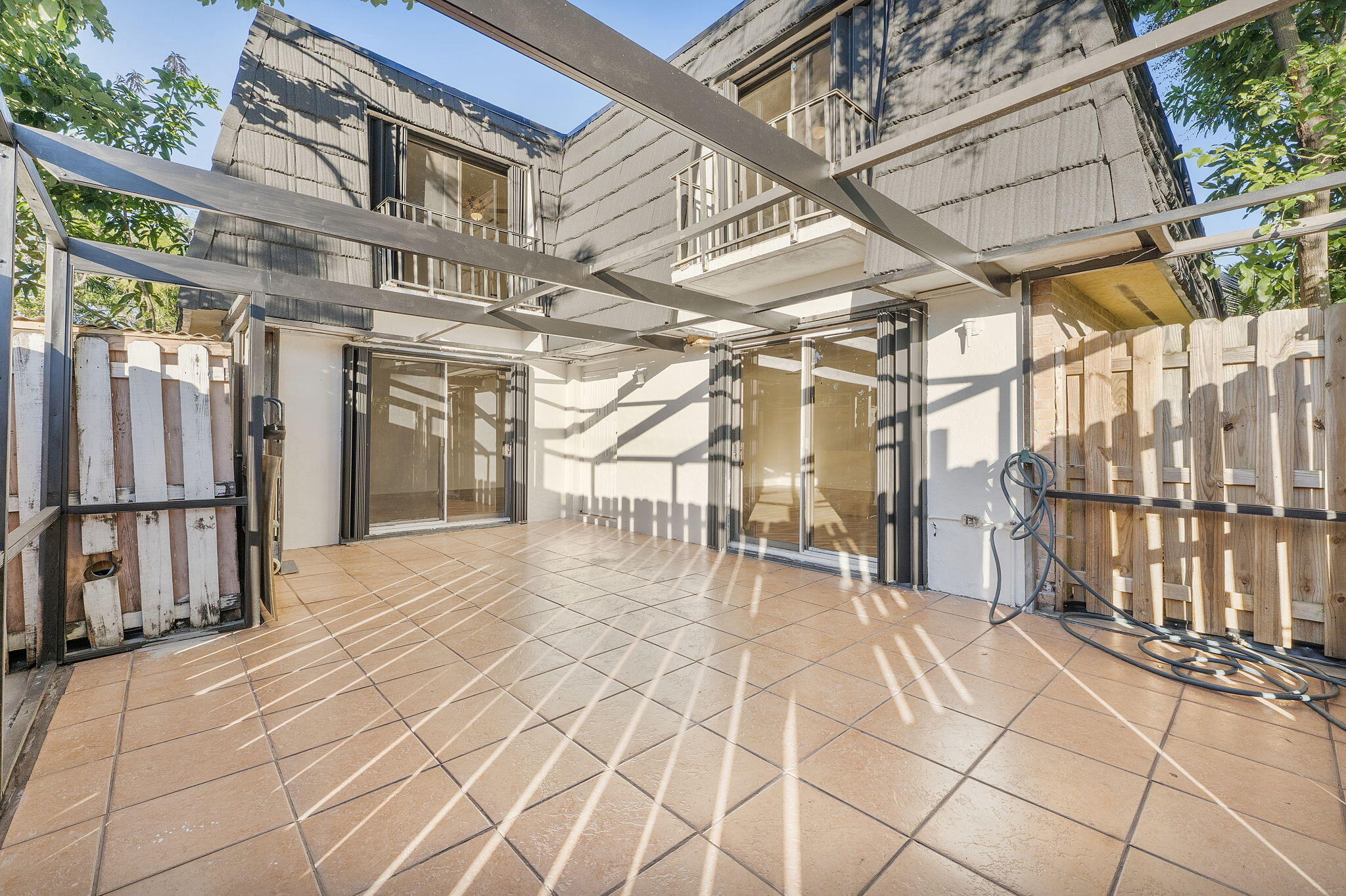 291 Woodland Road Palm Springs, FL 33461 - Photo 31 of 32 a view of a chairs with an outdoor space