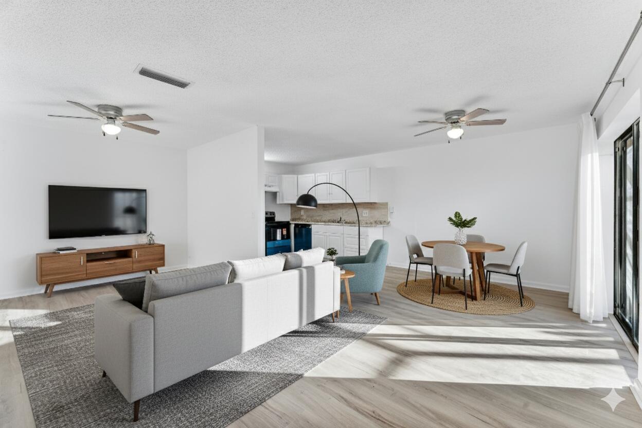 291 Woodland Road Palm Springs, FL 33461 - Photo 4 of 32 a living room with furniture and a flat screen tv