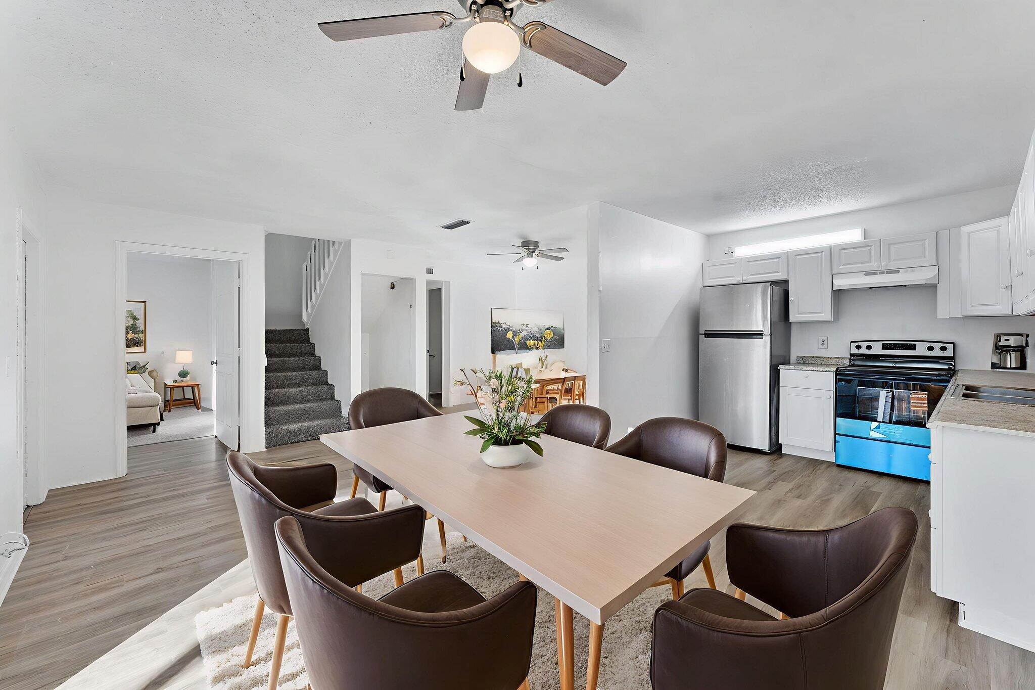 291 Woodland Road Palm Springs, FL 33461 - Photo 6 of 32 a view of kitchen and dining area with furniture