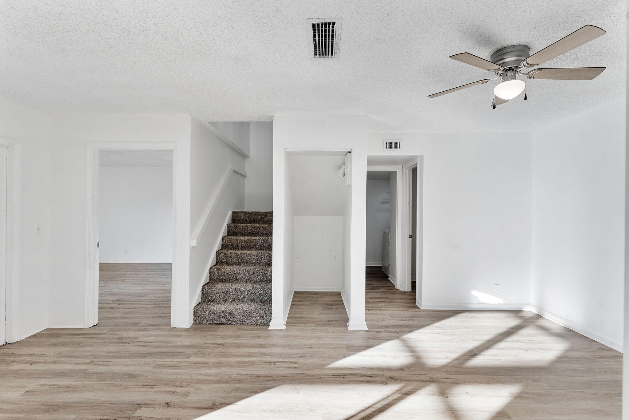 291 Woodland Road Palm Springs, FL 33461 - Photo 9 of 32 a view of entryway and hall with wooden floor