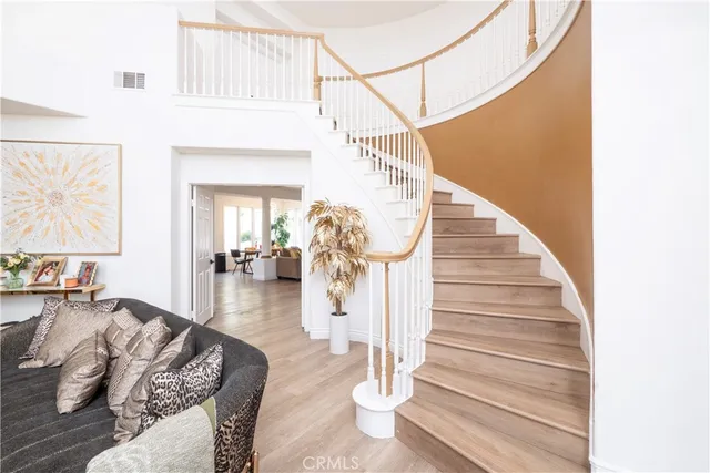 a open kitchen with stainless steel appliances kitchen island granite countertop a refrigerator and a stove