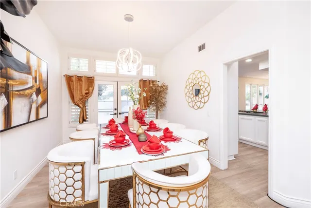 a kitchen that has a lot of counter top space and wooden floor
