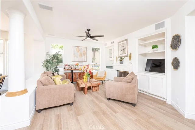 a room with furniture and flat screen tv