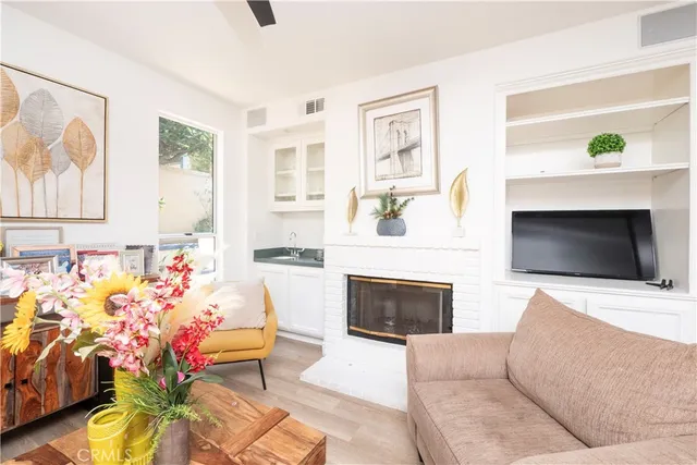 a bathroom with a sink toilet vanity and shower