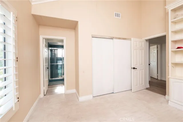 a kitchen with stainless steel appliances granite countertop a refrigerator and a stove