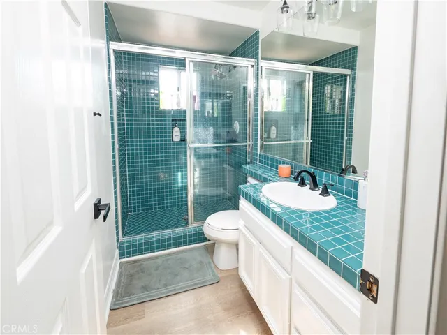 a very nice looking dining room with kitchen island a stove a table and chairs