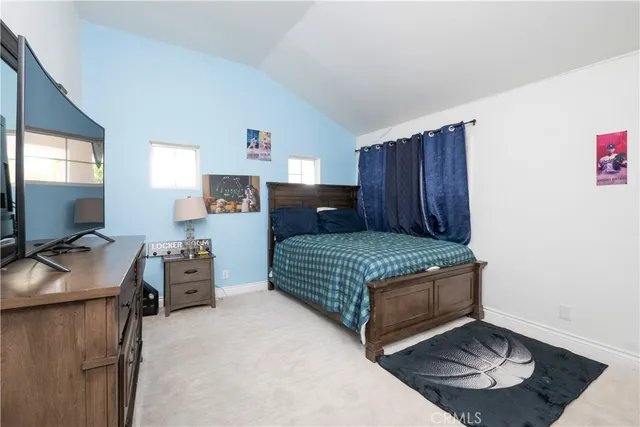 a bedroom with a bed and a cabinets