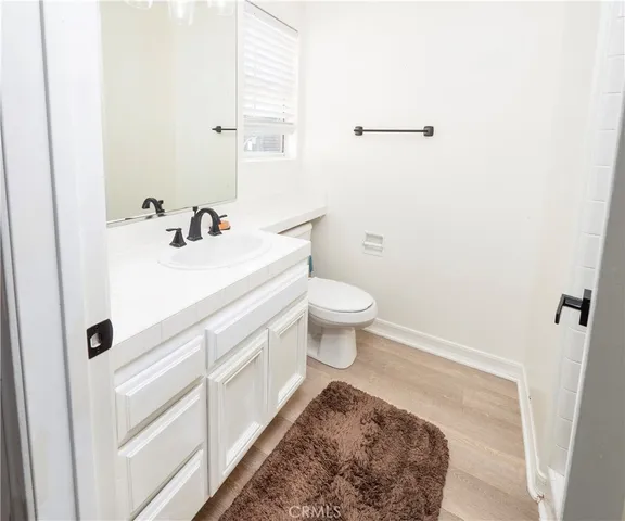 a spacious bathroom with a double vanity sink mirror and shower