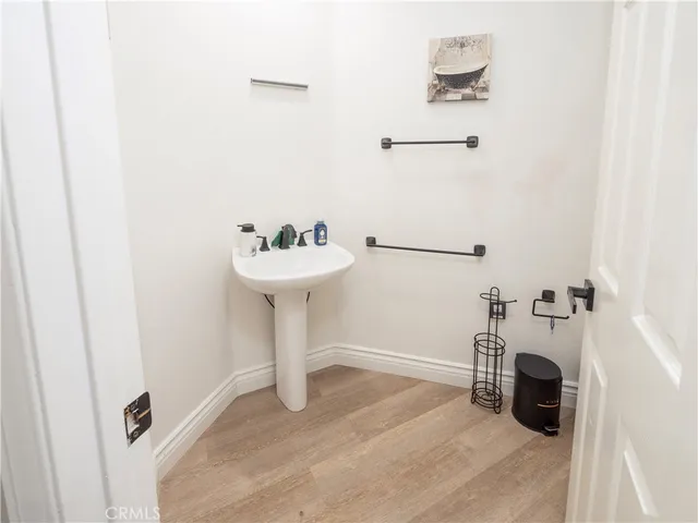 a spacious bedroom with a bed couch and a large window