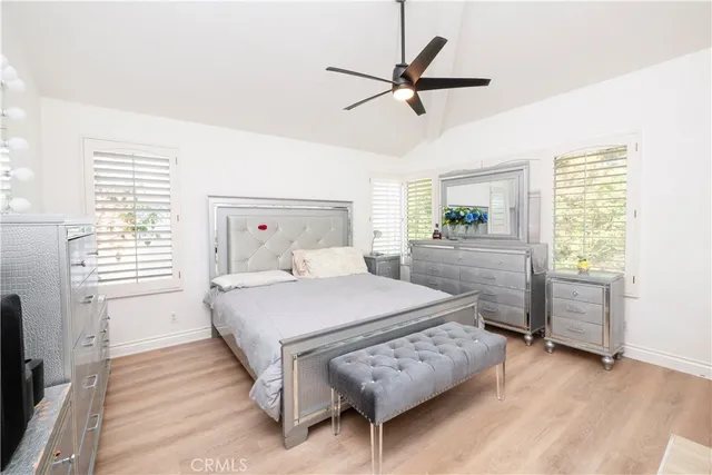 a room with a baby crib and a window