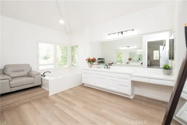 a view of outdoor sitting area with furniture and wooden fence