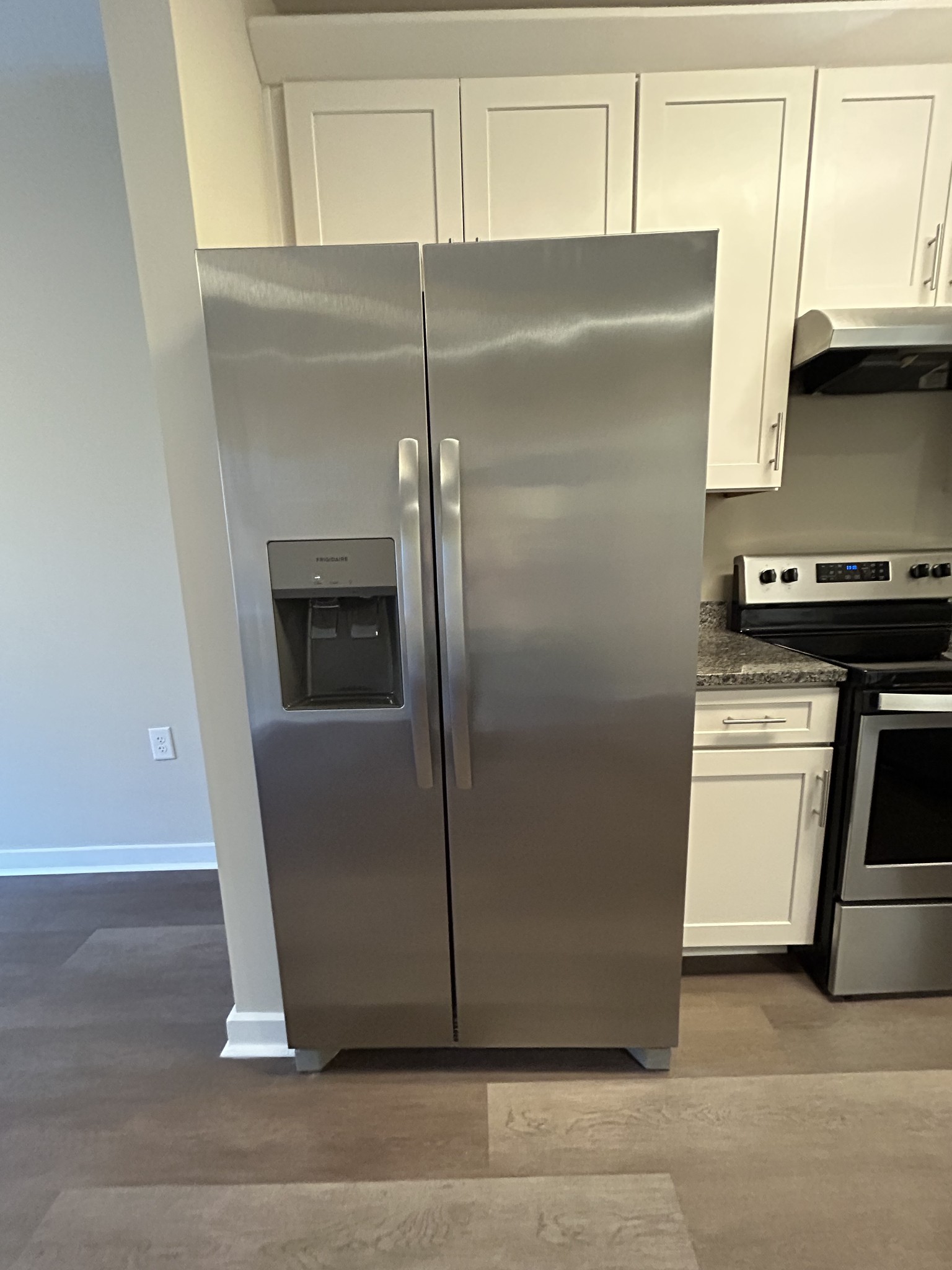 1319 West Main Street, Unit 108 Franklin, TN 37064 - Photo 12 of 25 a kitchen with metallic refrigerator and a stove top oven
