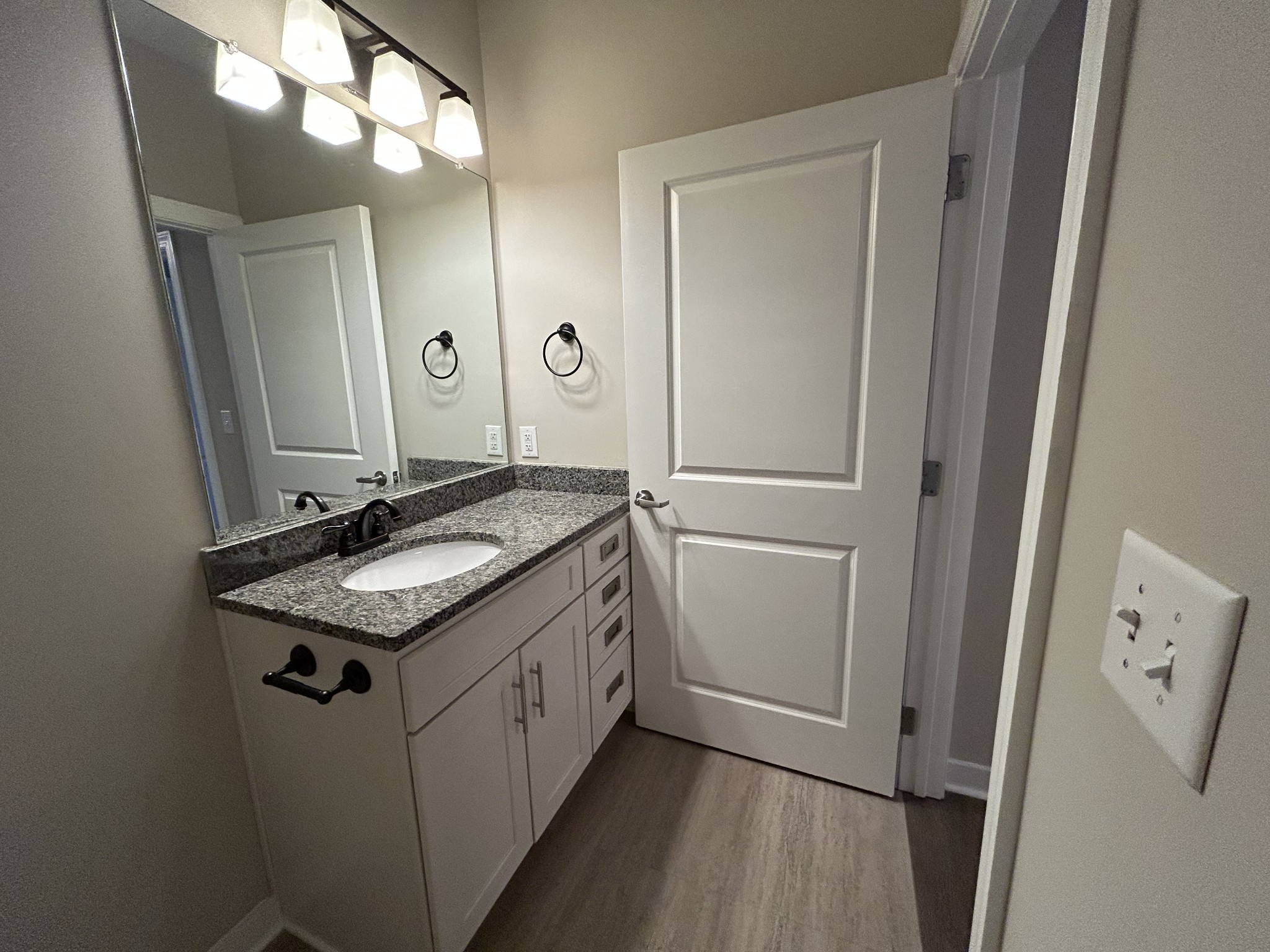 1319 West Main Street, Unit 108 Franklin, TN 37064 - Photo 17 of 25 a bathroom with a granite countertop sink and a mirror