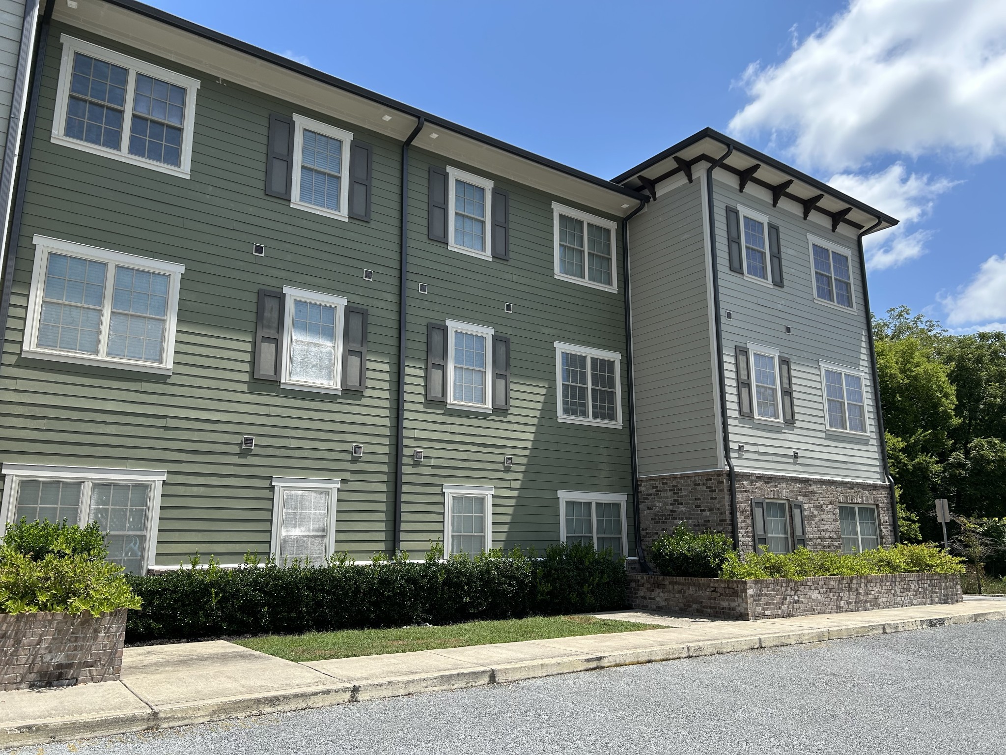 1319 West Main Street, Unit 108 Franklin, TN 37064 - Photo 21 of 25 a front view of a house with a yard