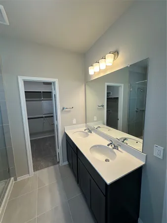 a white toilet sitting next to a shower