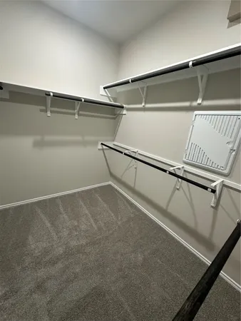 a view of a hallway with stairs