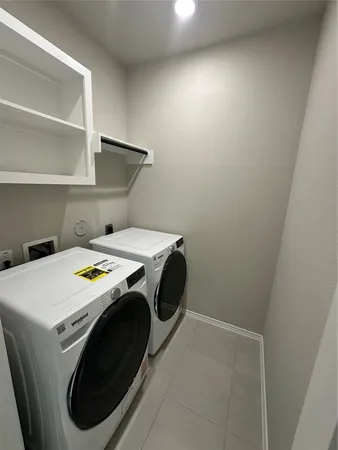 a view of kitchen with sink and microwave
