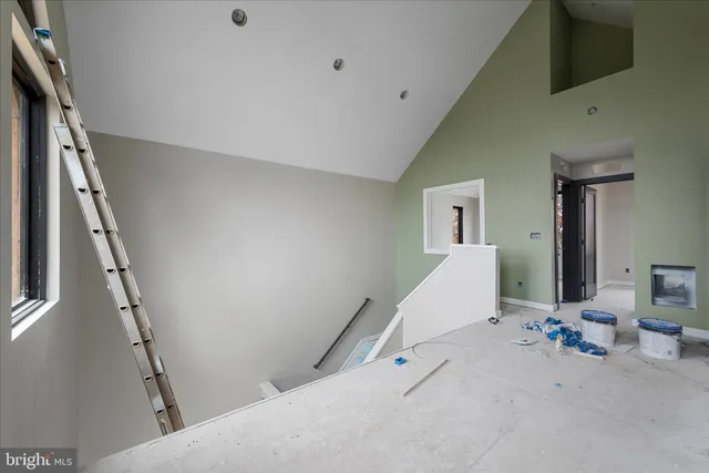 a bed room with a bed and a window