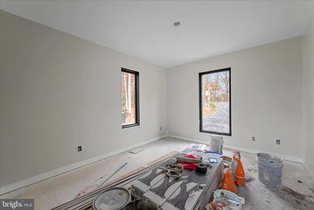 a bedroom with bed and a table