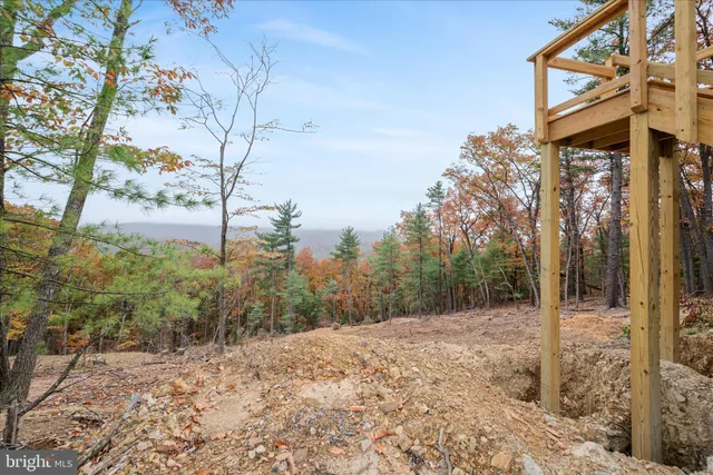 a view of a yard covered with snow in the background
