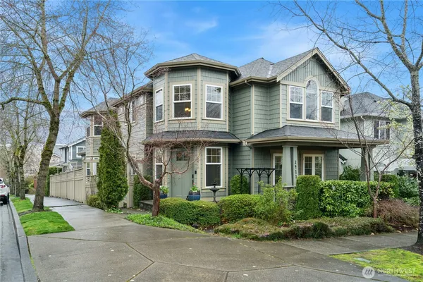 a front view of a house with outdoor seating and plants