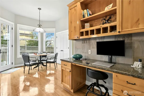 a dining room with furniture and window