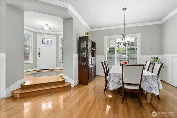 a view of a dining room with furniture window and wooden floor