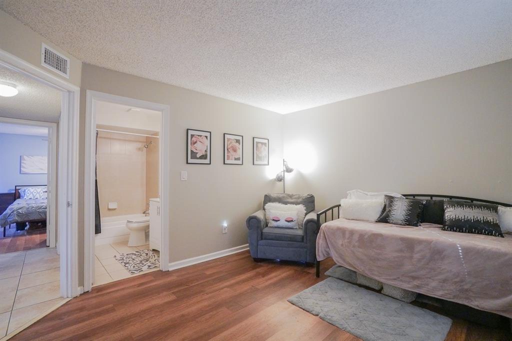 1011 Crystal Way, Unit P Delray Beach, FL 33444 - Photo 15 of 28 a bedroom with furniture and wooden floor