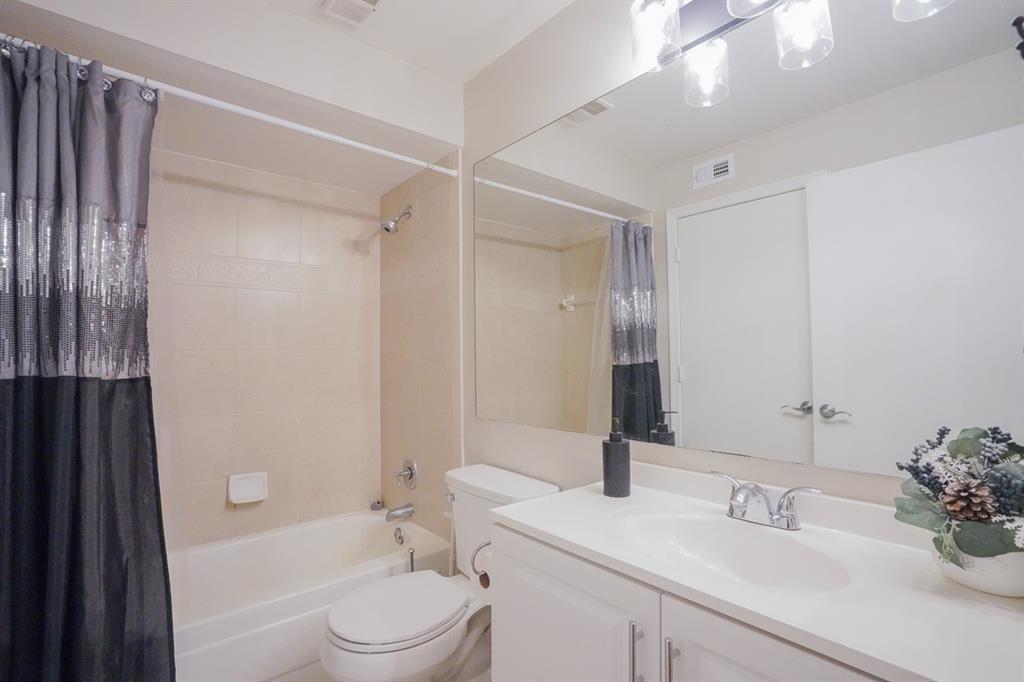 1011 Crystal Way, Unit P Delray Beach, FL 33444 - Photo 16 of 28 a bathroom with a sink a toilet and shower