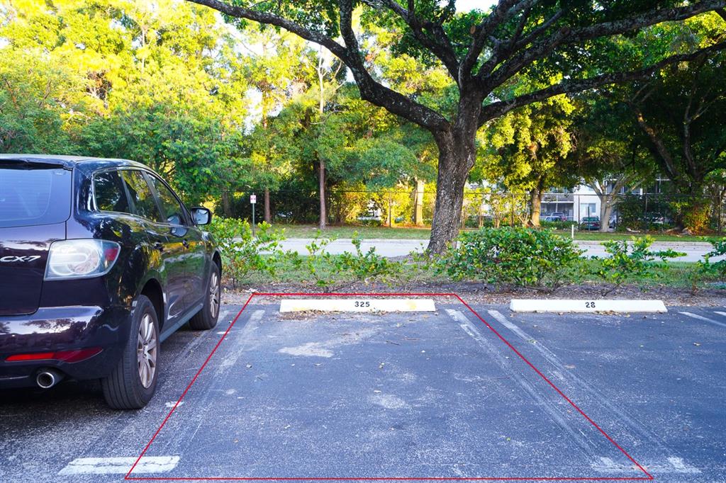 1011 Crystal Way, Unit P Delray Beach, FL 33444 - Photo 21 of 28 a house view with a garden space