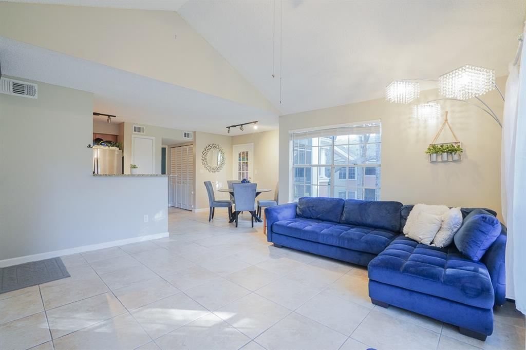 1011 Crystal Way, Unit P Delray Beach, FL 33444 - Photo 5 of 28 a living room with furniture and a window