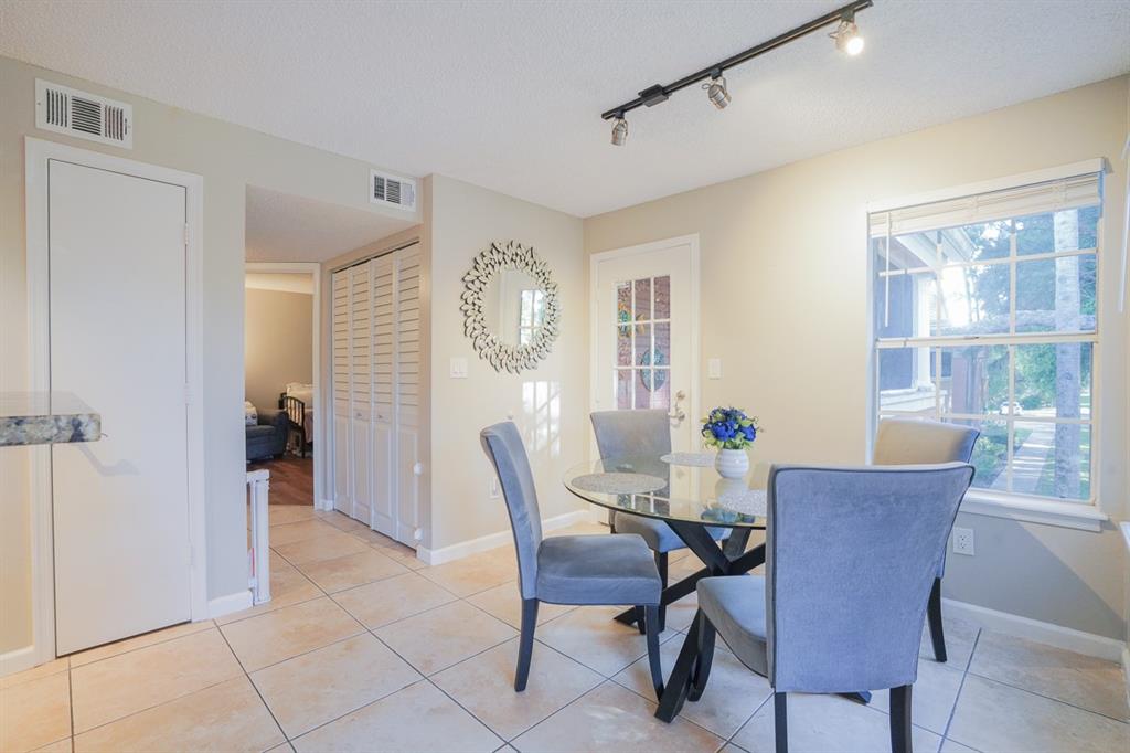 1011 Crystal Way, Unit P Delray Beach, FL 33444 - Photo 6 of 28 a dining room with furniture and window