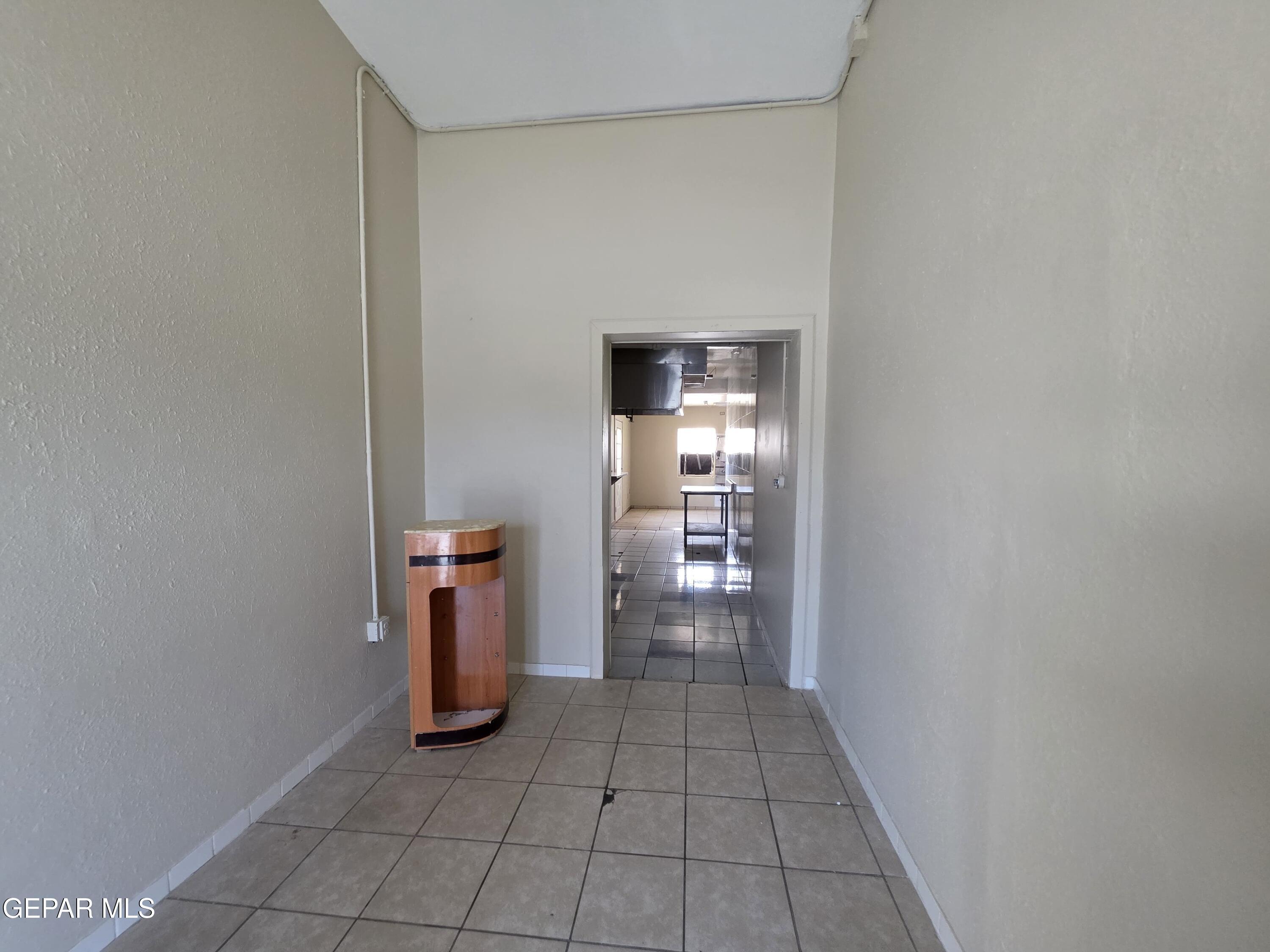 11661 Socorro Road Socorro, TX 79927 - Photo 33 of 33 a view of a kitchen with fridge and wooden floor