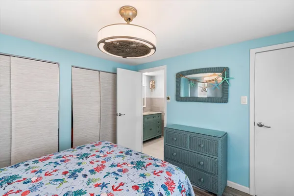 a bedroom with a bed and a dresser