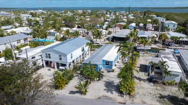 an aerial view of a house with a garden