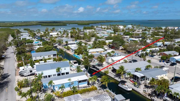 a view of multiple houses with yard