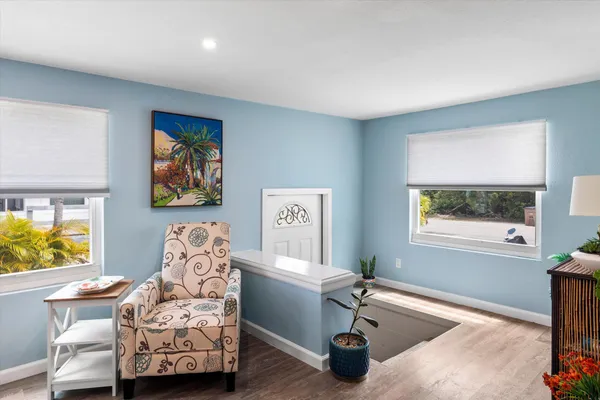 a bedroom with furniture and a window