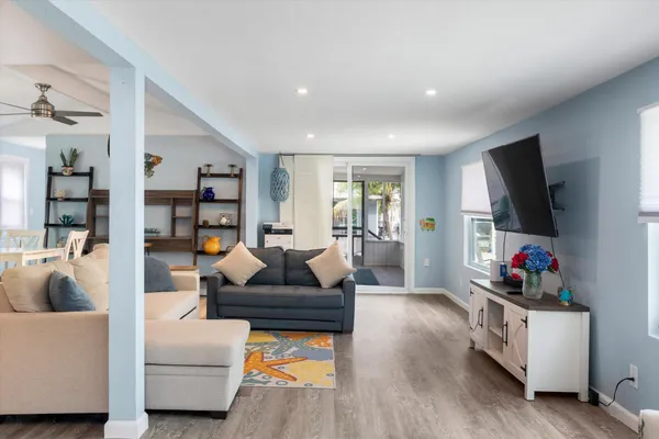 a living room with furniture and a flat screen tv