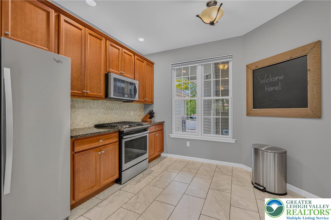 4236 Creek Road Allentown, PA 18104 - Photo 10 of 47 Ample wooden cabinetry and durable tiled flooring define this classic culinary space.