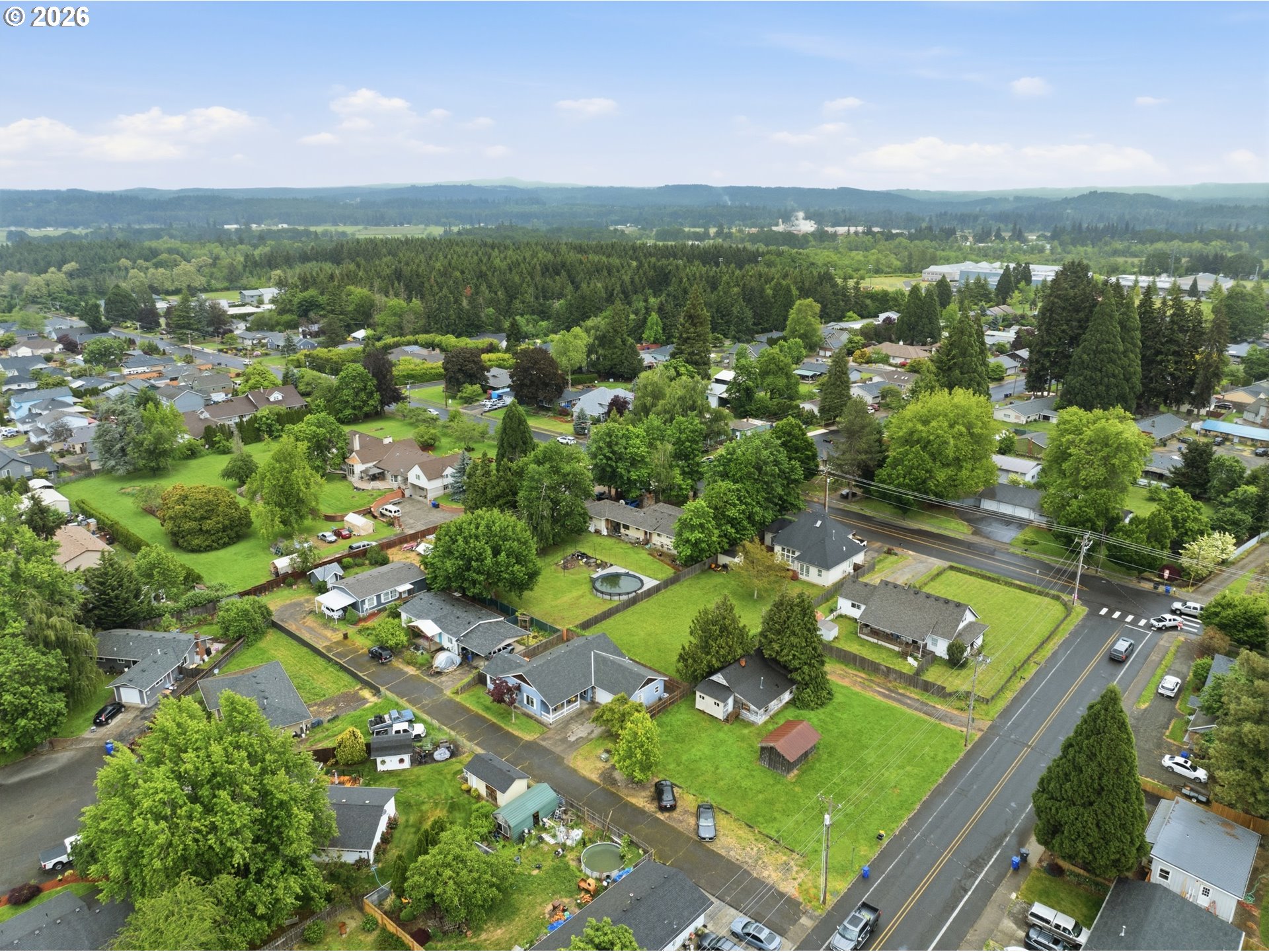 105 Toliver Road Molalla, OR 97038 - Photo 30 of 34 an aerial view of green landscape with trees houses and lake view