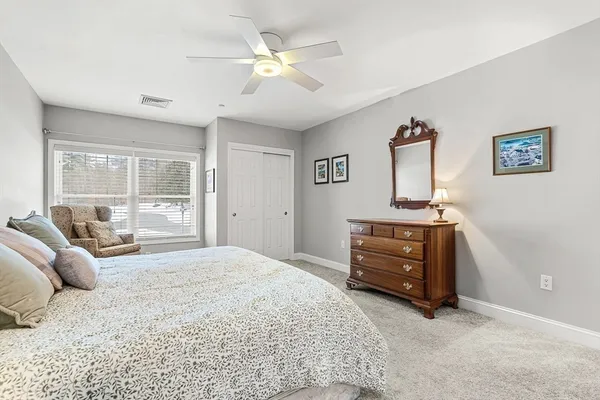 a bedroom with a bed and furniture