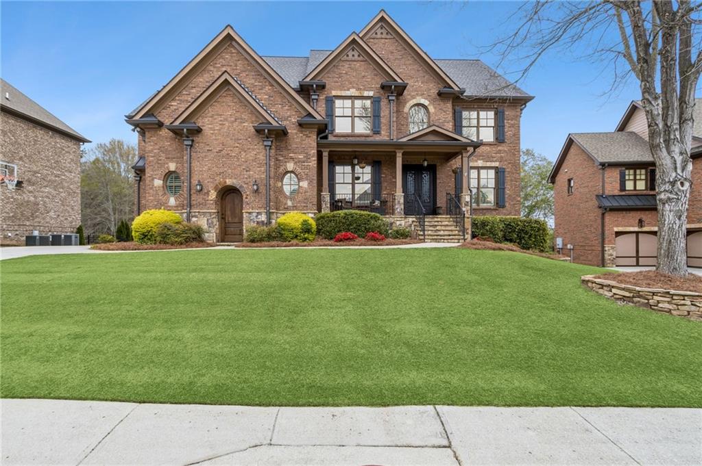 2391 Hopehaven Way Hoschton, GA 30548 - Photo 13 of 87 a front view of a house with a yard