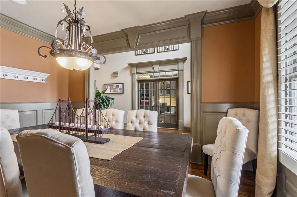 2391 Hopehaven Way Hoschton, GA 30548 - Photo 16 of 87 a view of a dining room with furniture window and wooden floor